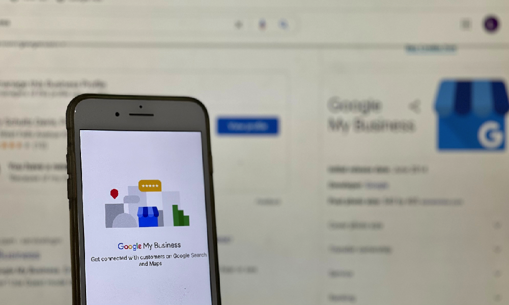 Listing your business on Google: oogle My Business app - computer screen in background.