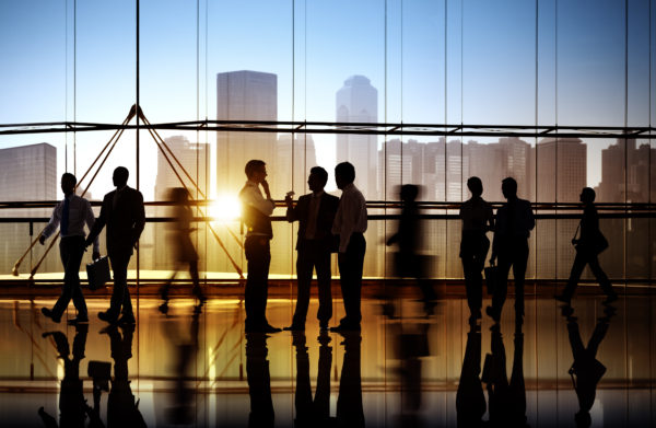 Busy people overlooking the city
