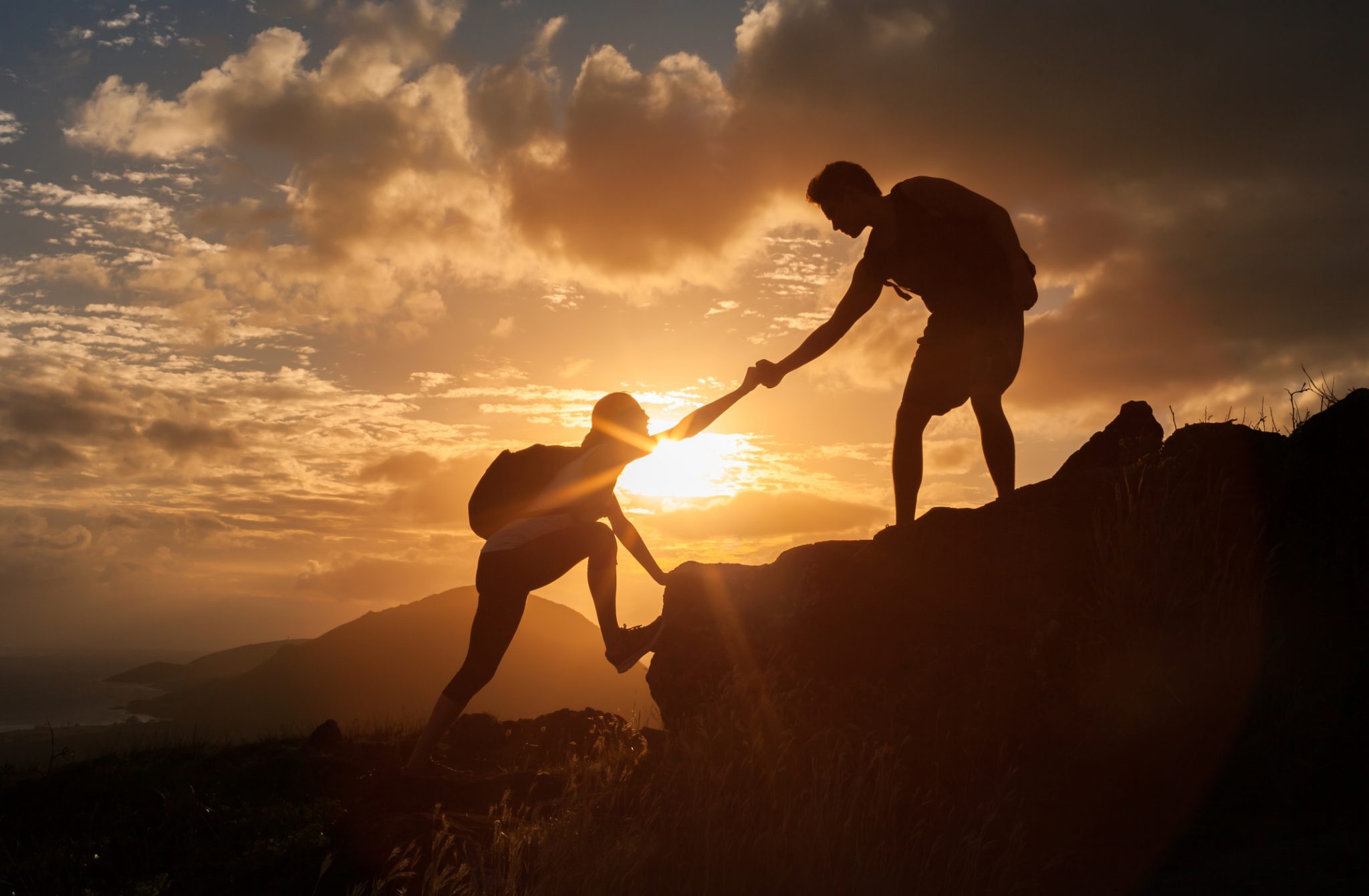 Man helping a climber