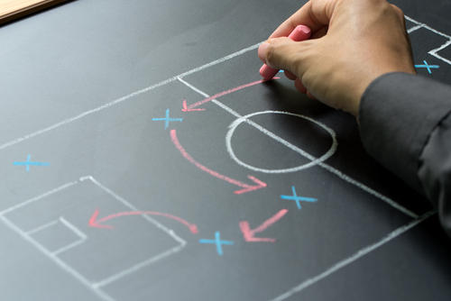 Man Drawing a Game Plan