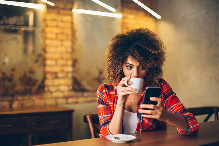 Woman-using-mobile-phone-538172904_750px