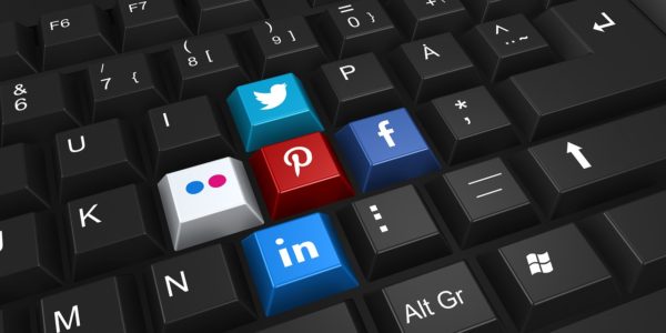 keyboard with social media icons - twitter, pinterest, facebook, and linkedin