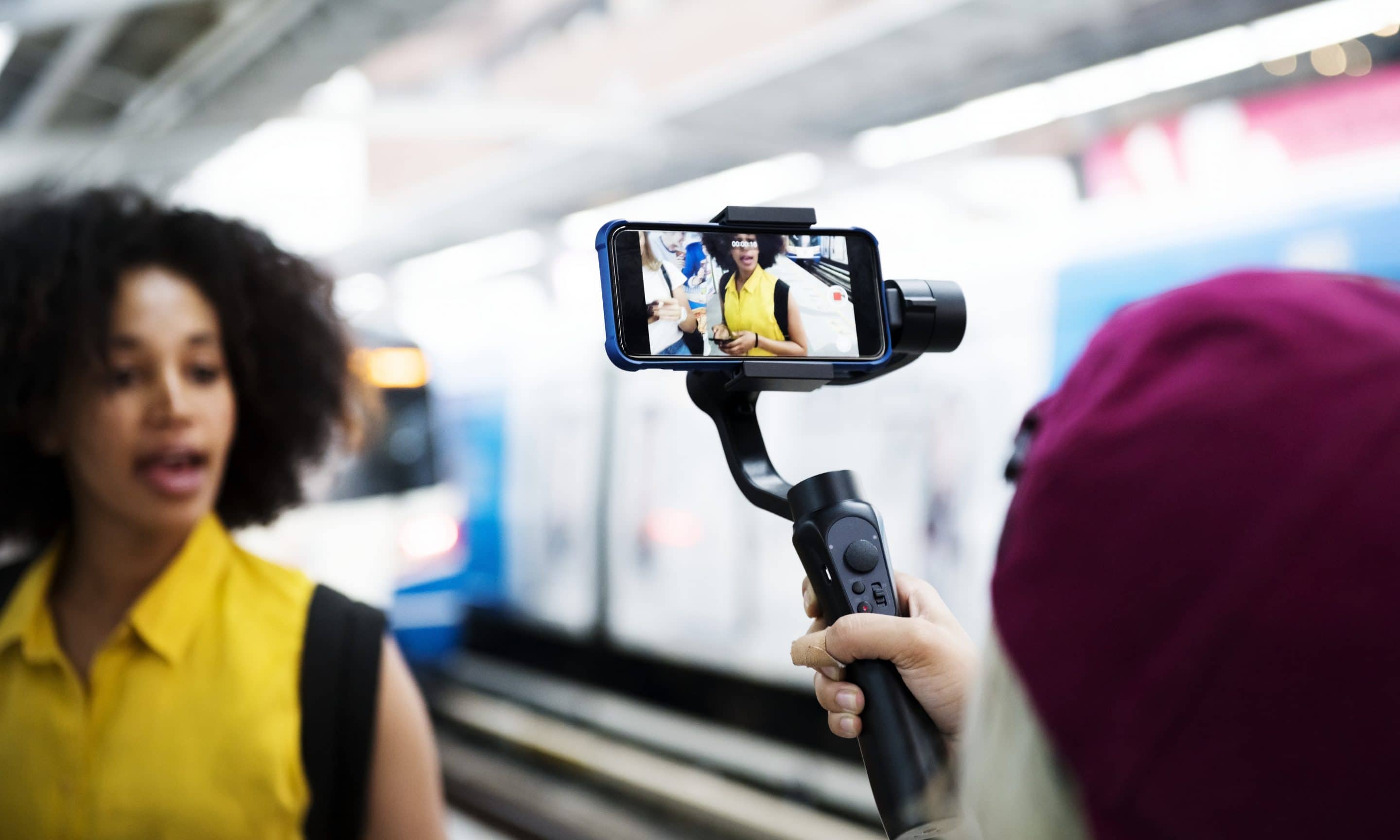 Young adult woman traveling and vlogging social media