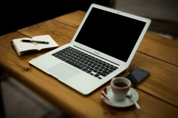 Content writing concept art with laptop, pen and paper