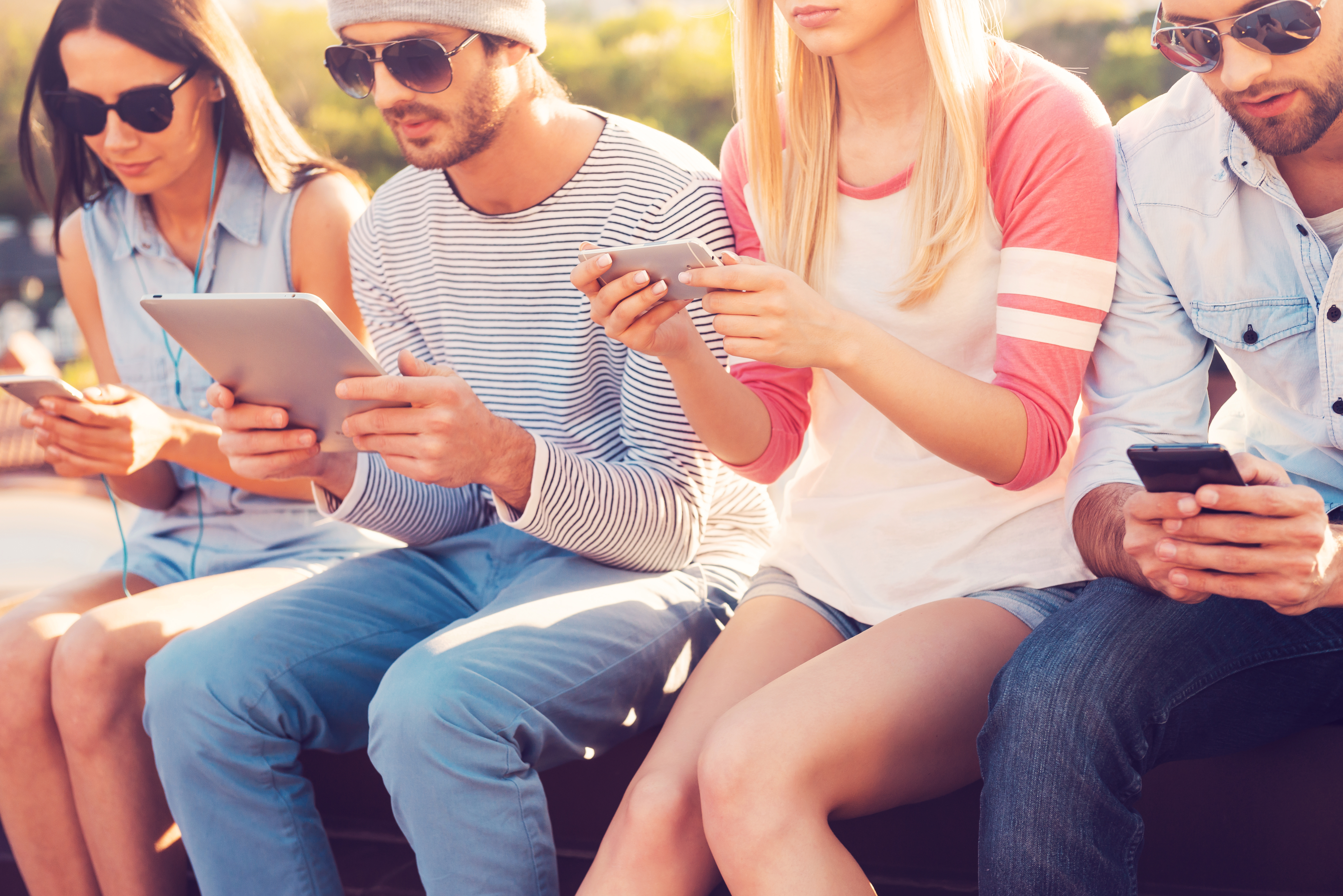 Marketing on TikTok - Group of people gathered around on their phones
