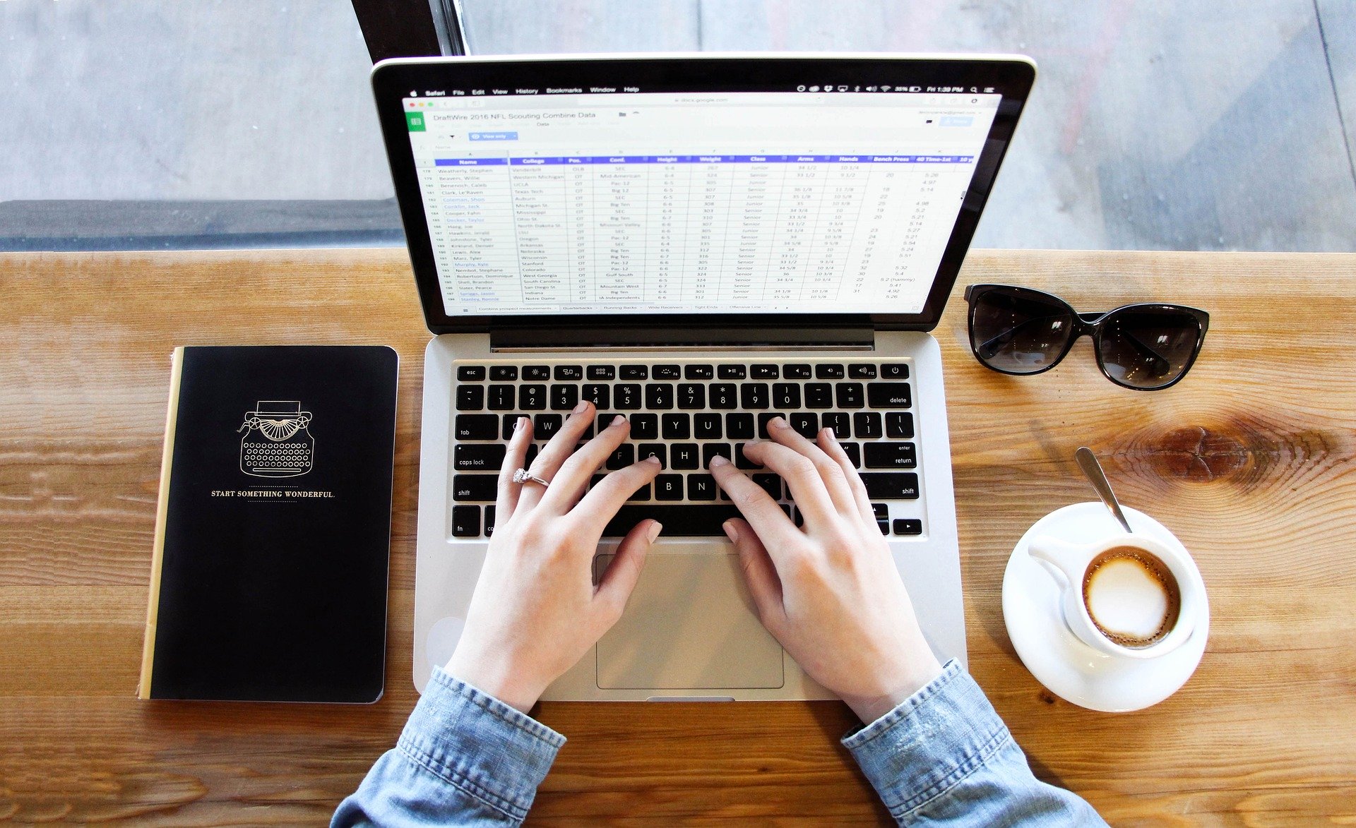 A woman doing data entry on a laptop.