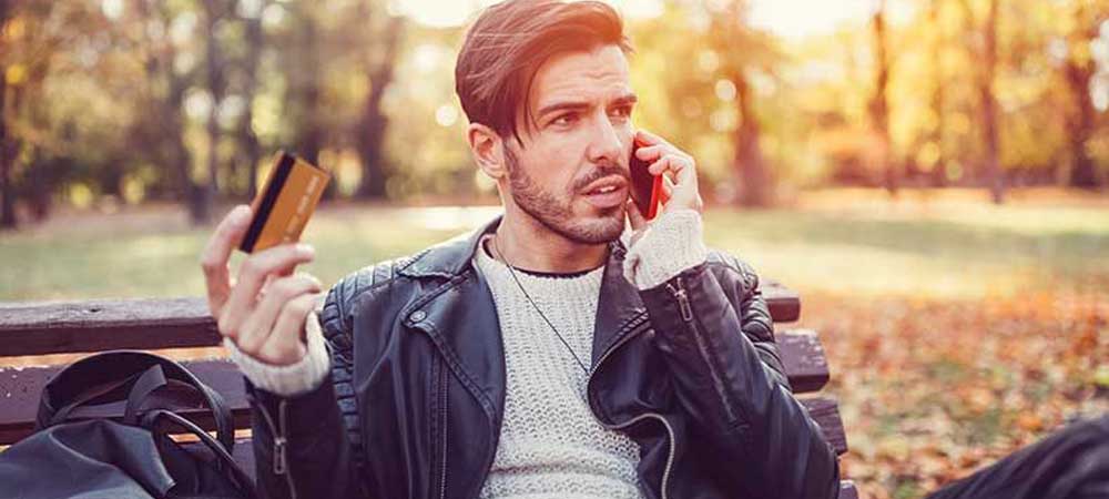 man on phone victim of vishing scam