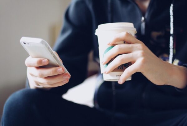 Coffee and customer using the phone - Photo credit: Twenty20.