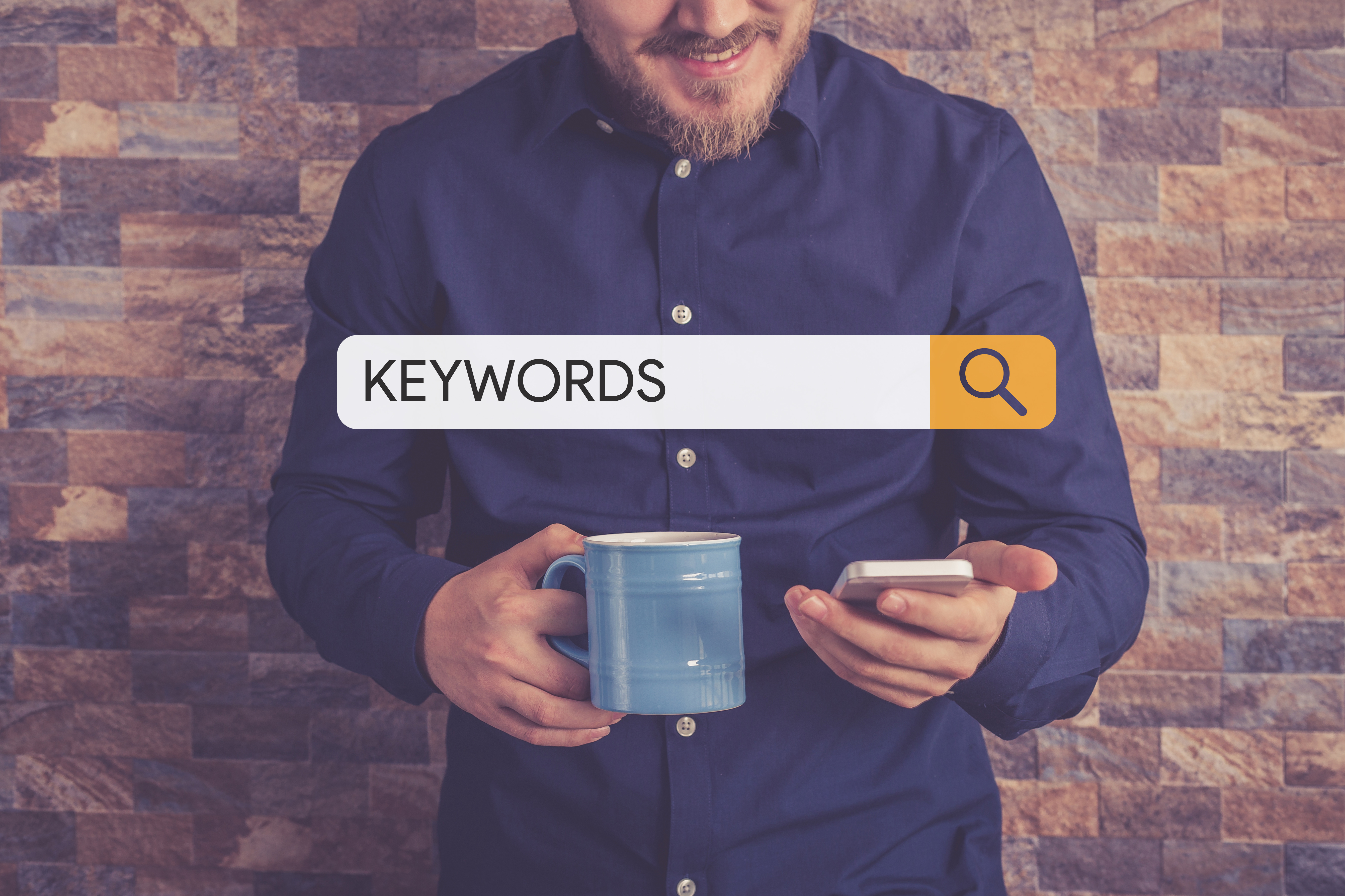 Man searching keywords on his phone.