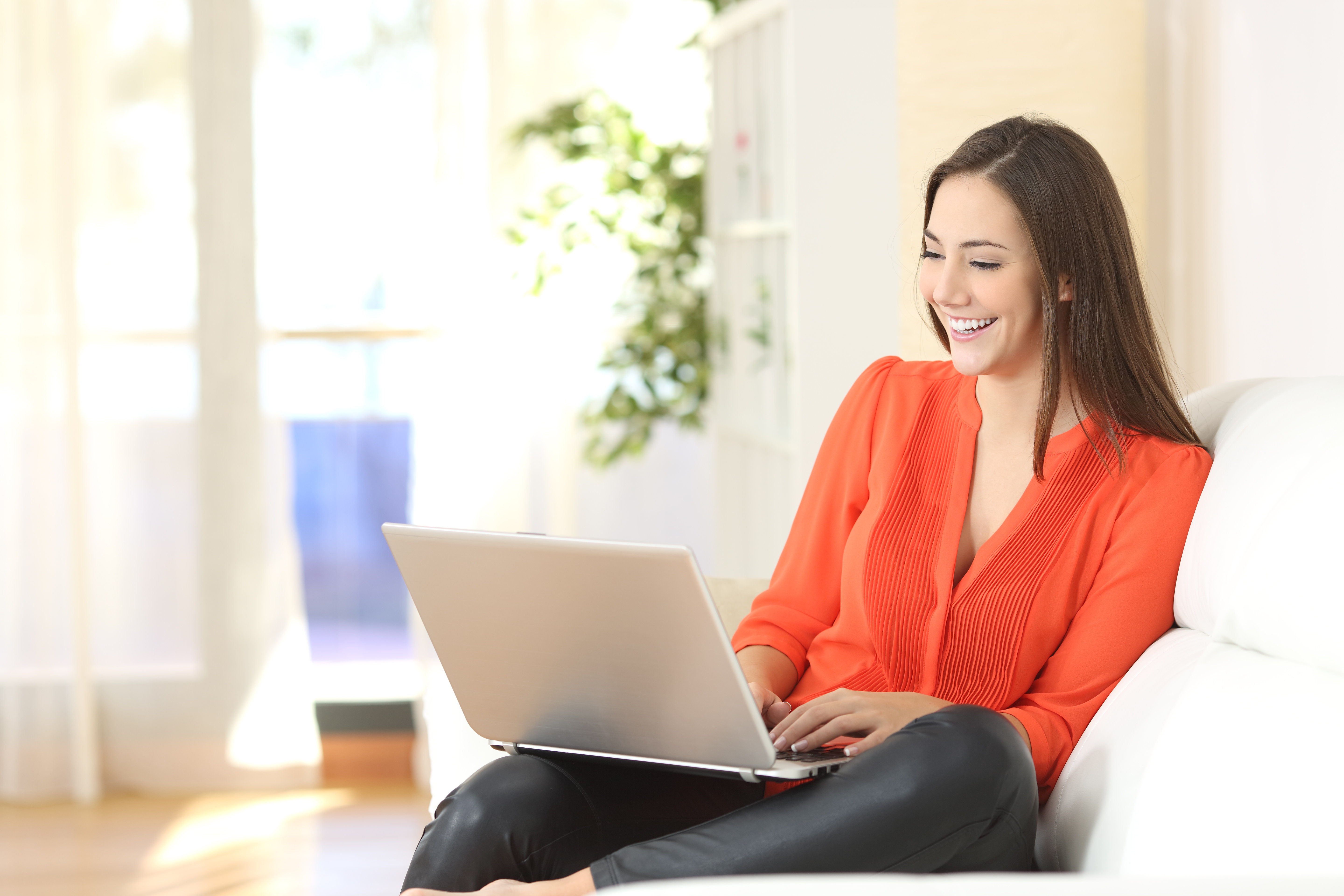 Woman on laptop performing content marketing