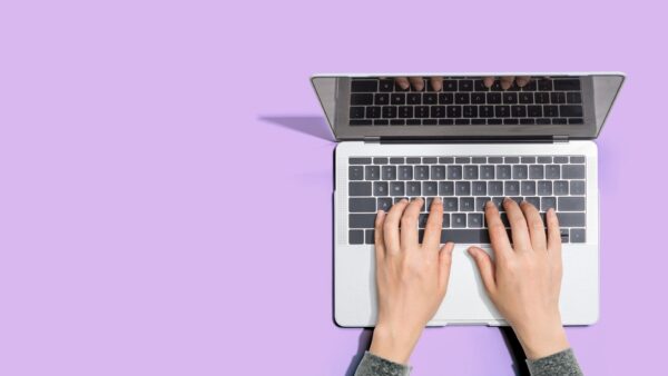 laptop from above, on purple background