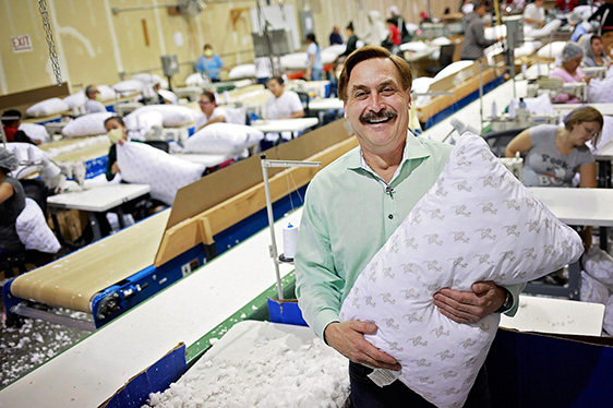 Mike Lindell holding a pillow
