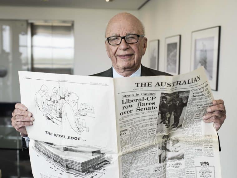 Rupert Murdoch reading a newspaper