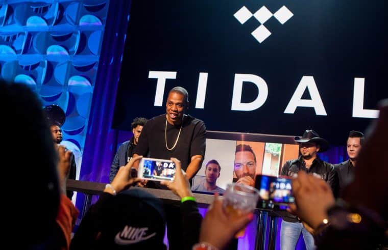 Jayz in front of Tidal banner