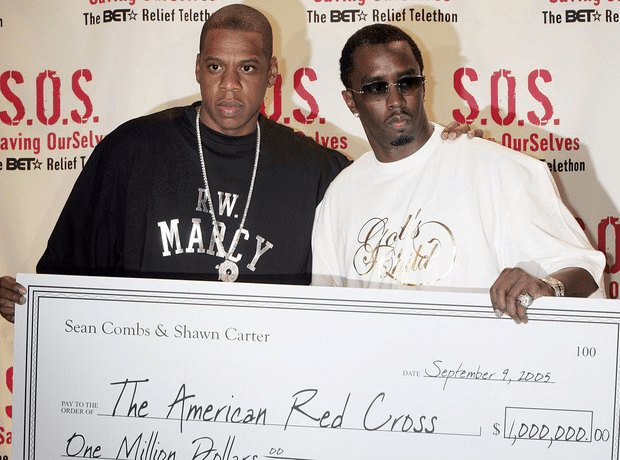 Jayz and a friend with a big check