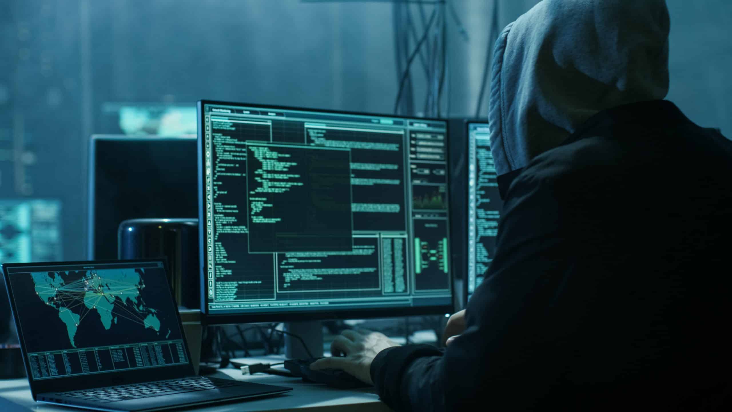hacker looking at a computer