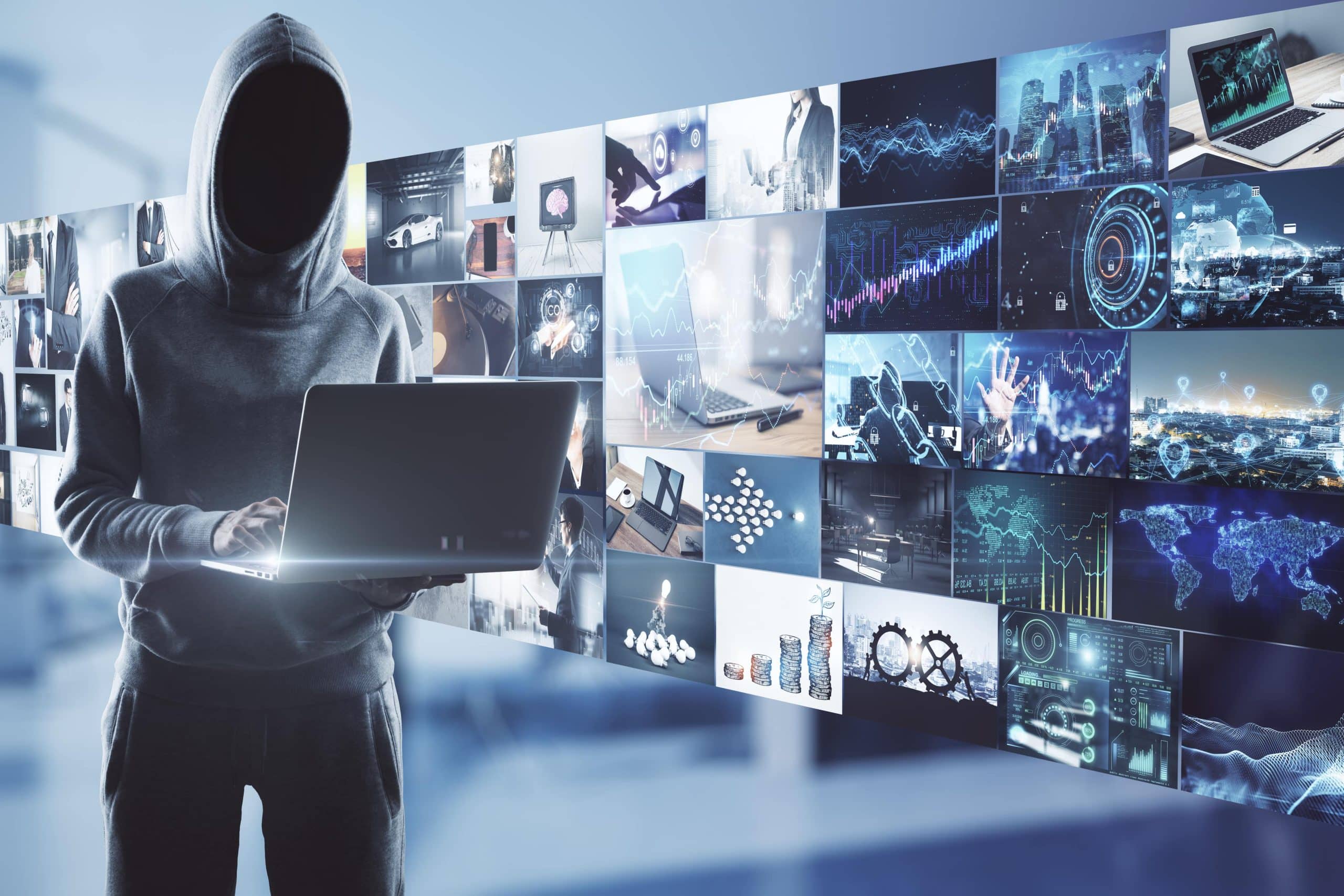 hacker with screens behind him