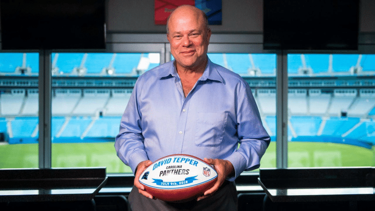 David Tepper with a football