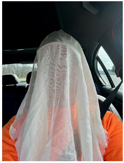 researcher wearing a cloth to perform IIHS test