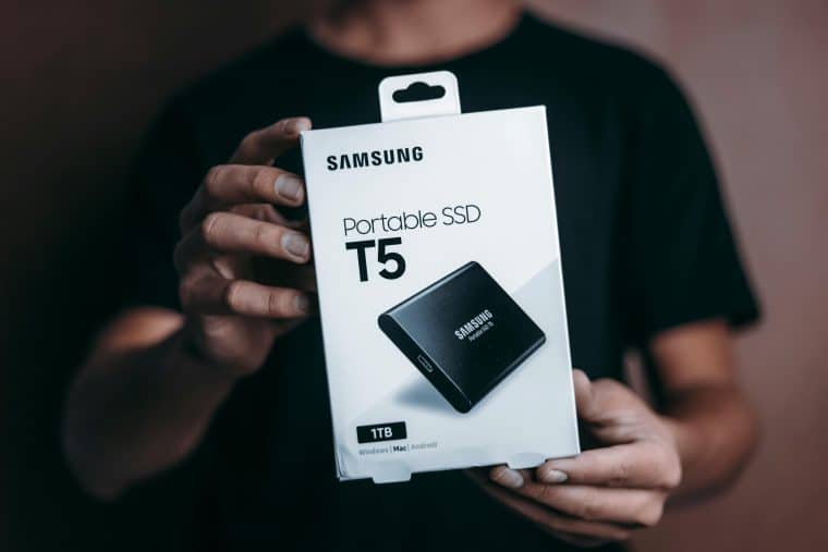 Photo of a person holding a Samsung portable SSD TB