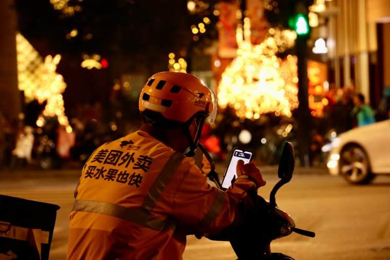 Photo of a Meituan deliverer on a motorcycle