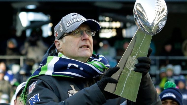 Paul Allen holding the Lombardi Trophy
