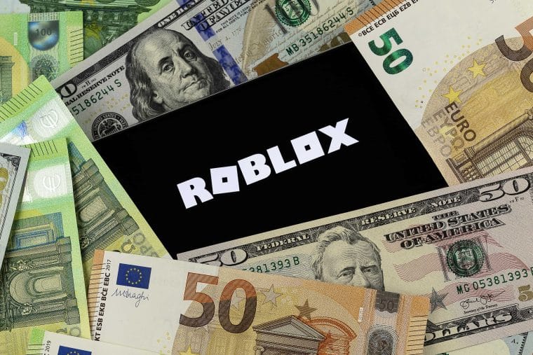 Roblox logo surrounded by money