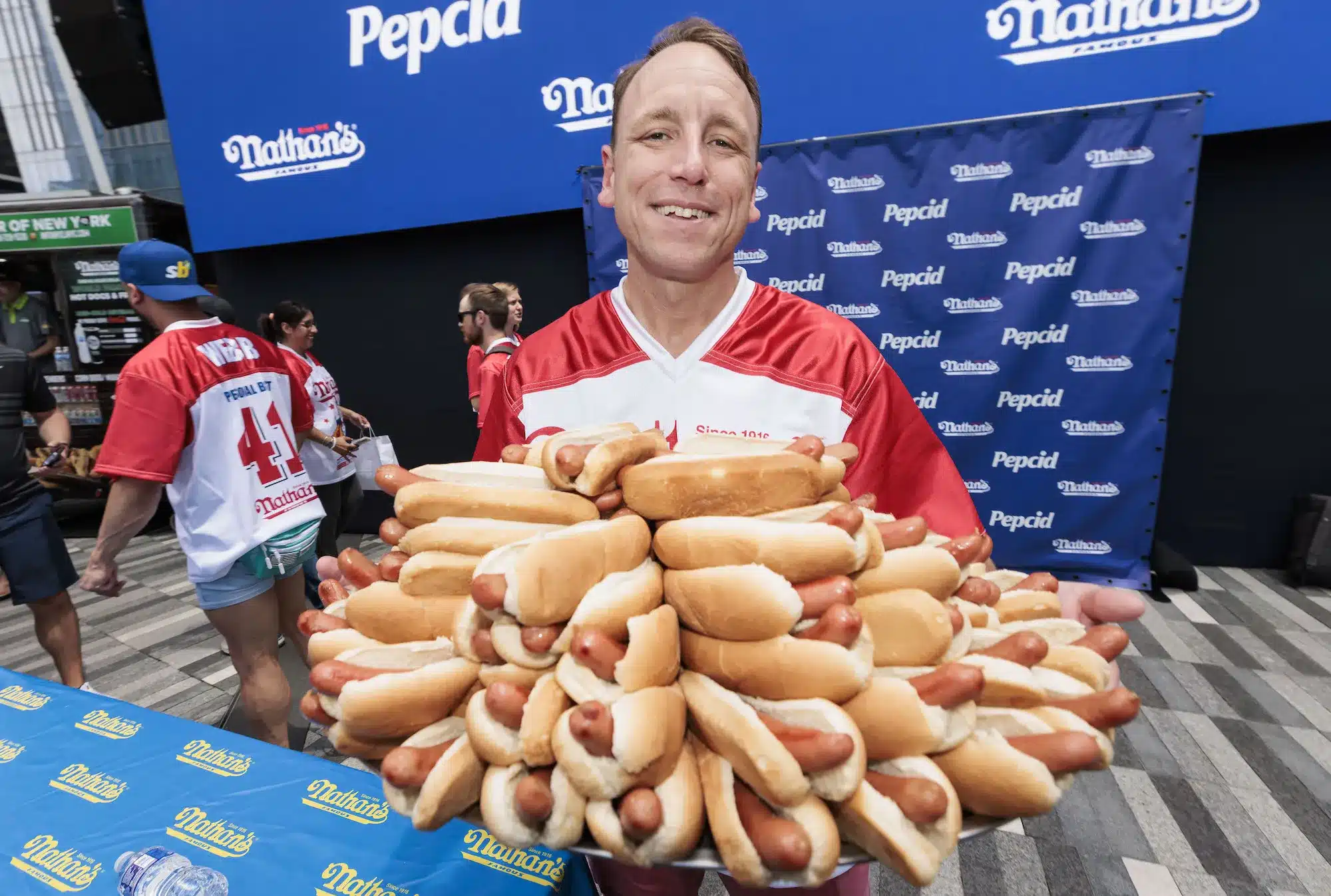 Joey Chestnut with a lot of hot dogs