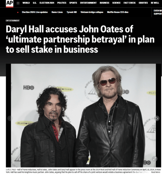 AP News article titled Daryl Hall accuses John Oates of "ultimate partnership betrayal" in plan to sell stake in business